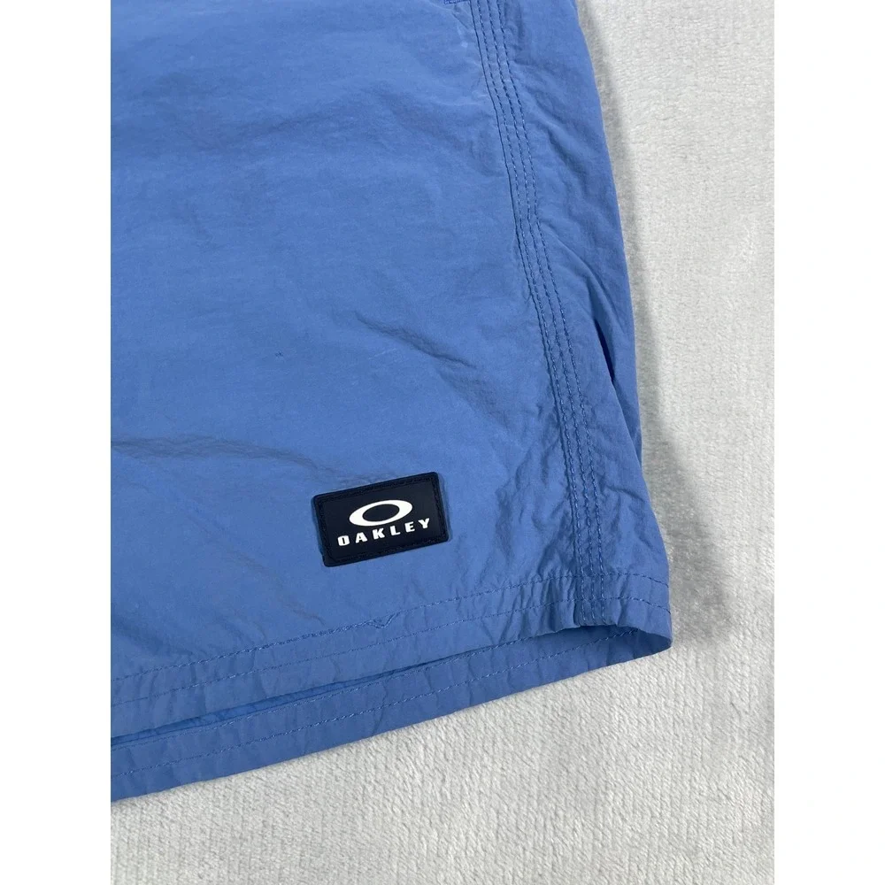 Oakley Swim Trunks Men Medium Blue Board Shorts Mesh Lined Beach Surf Logo